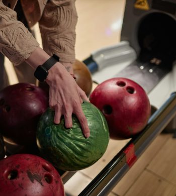 Choosing Bowling Ball at Bowling Alley