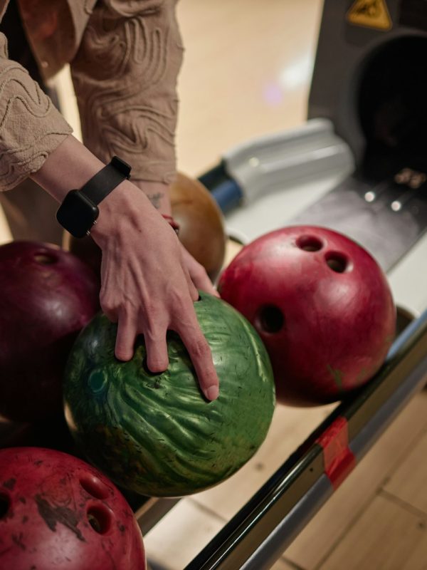 Choosing Bowling Ball at Bowling Alley